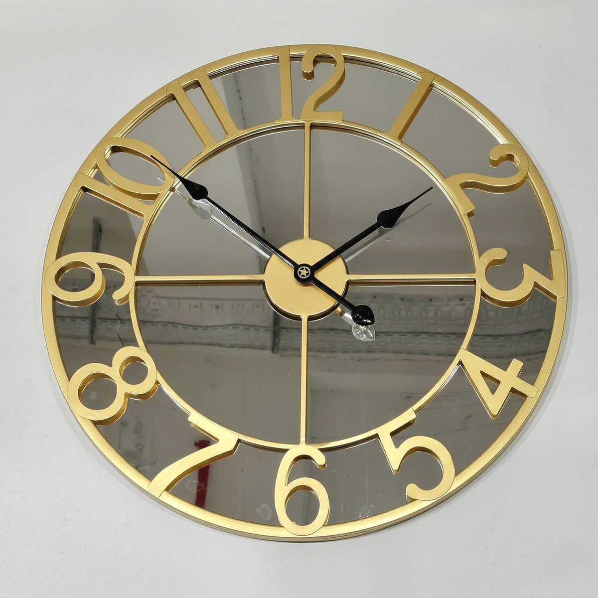 Grande horloge miroir doré