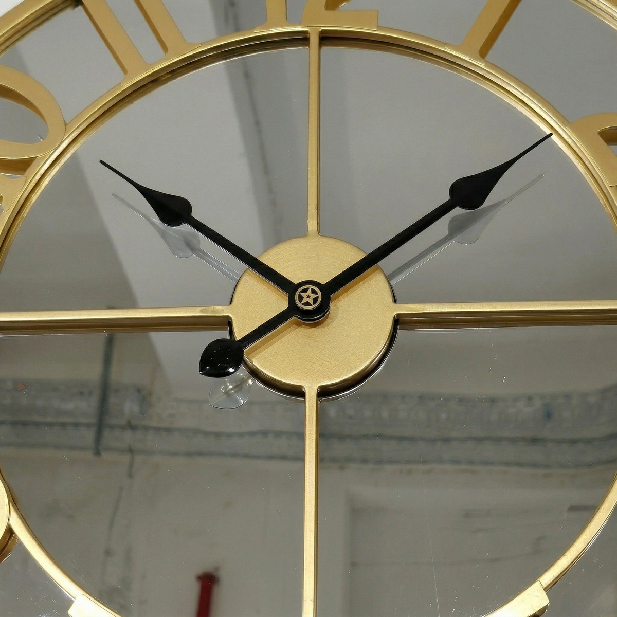 Grande horloge miroir doré